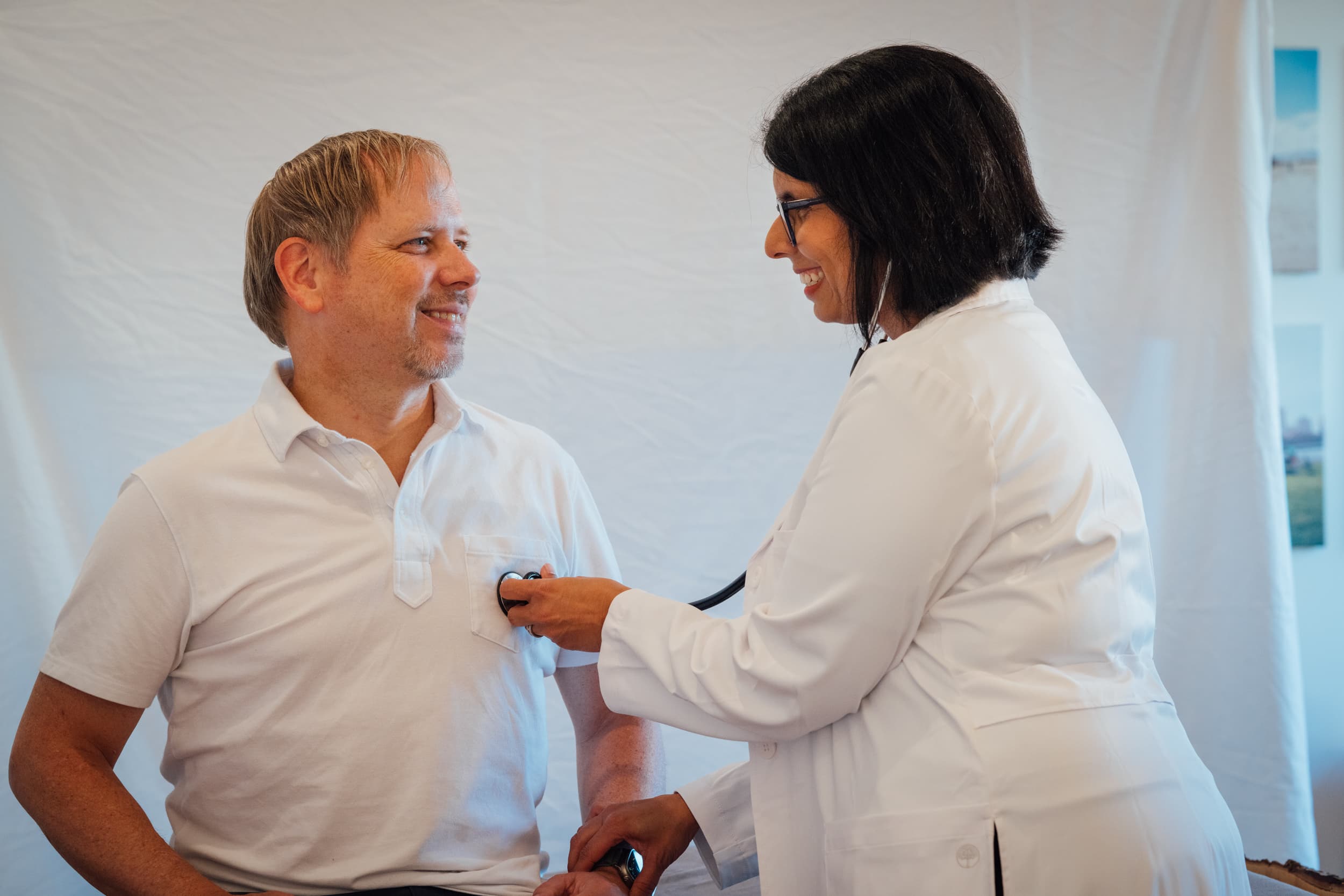 A doctor with a patient in a doctor's office