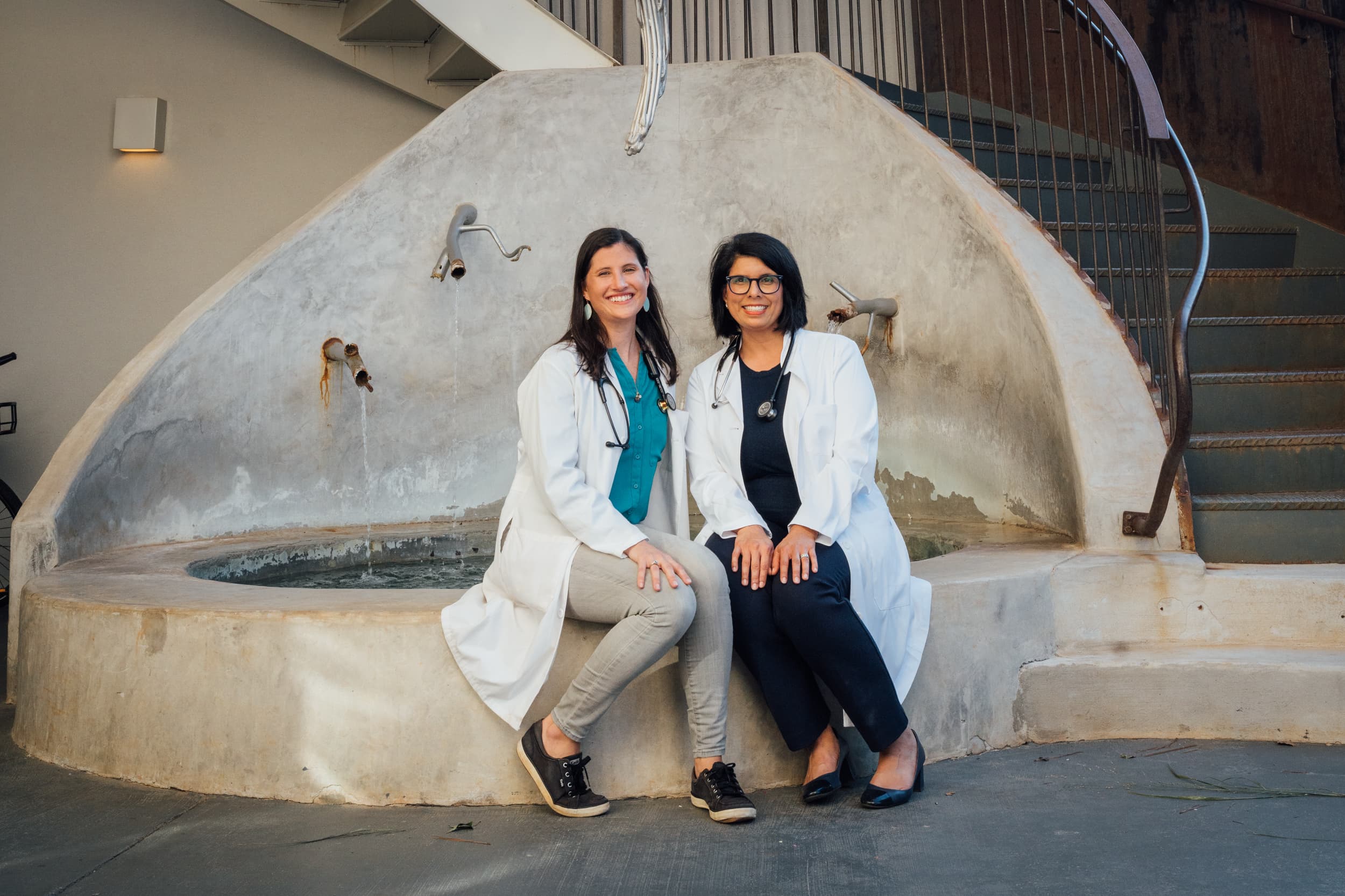 Doctors Blackmon and Escalante outside of the office in Serenbe