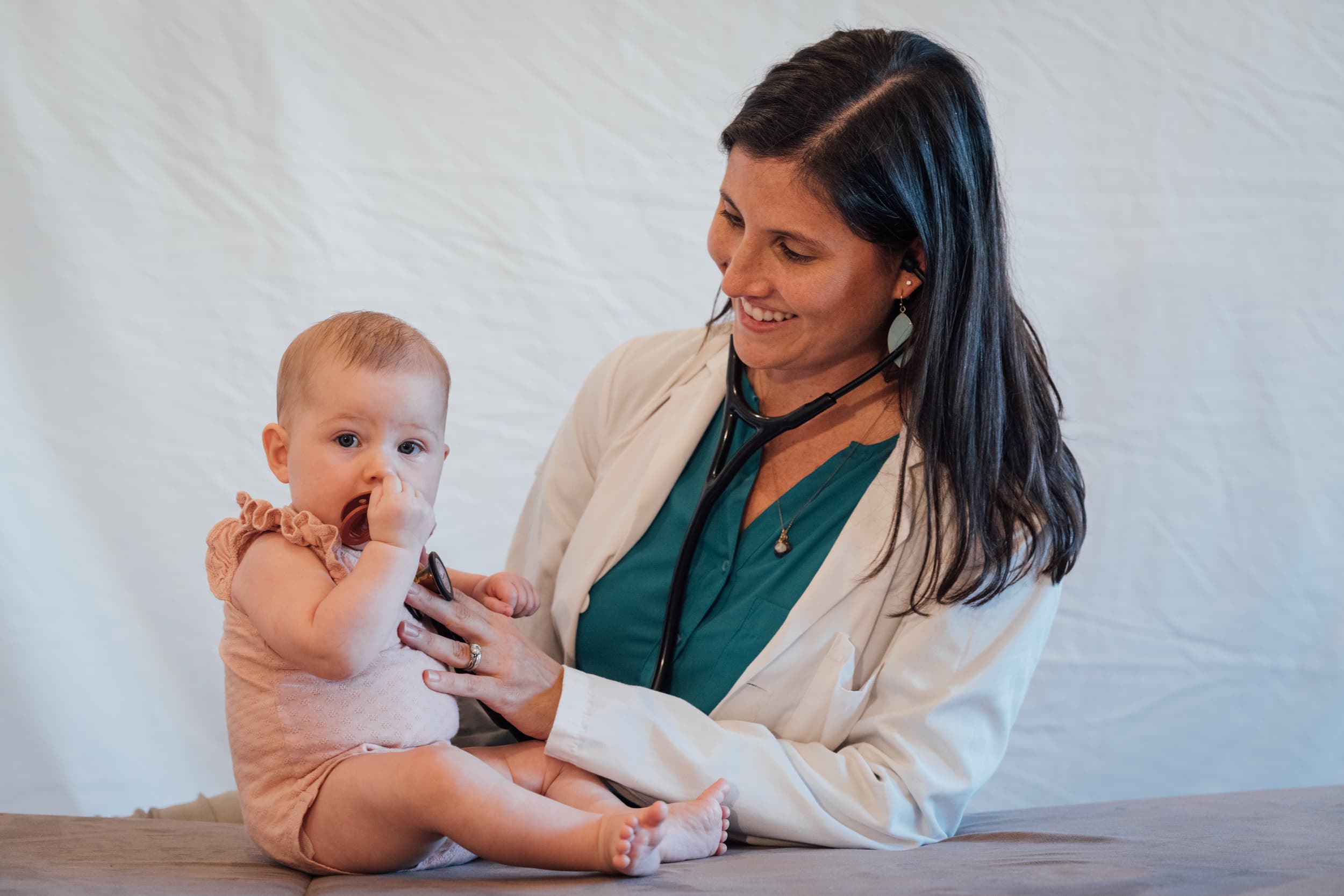 A pediatrician with a child