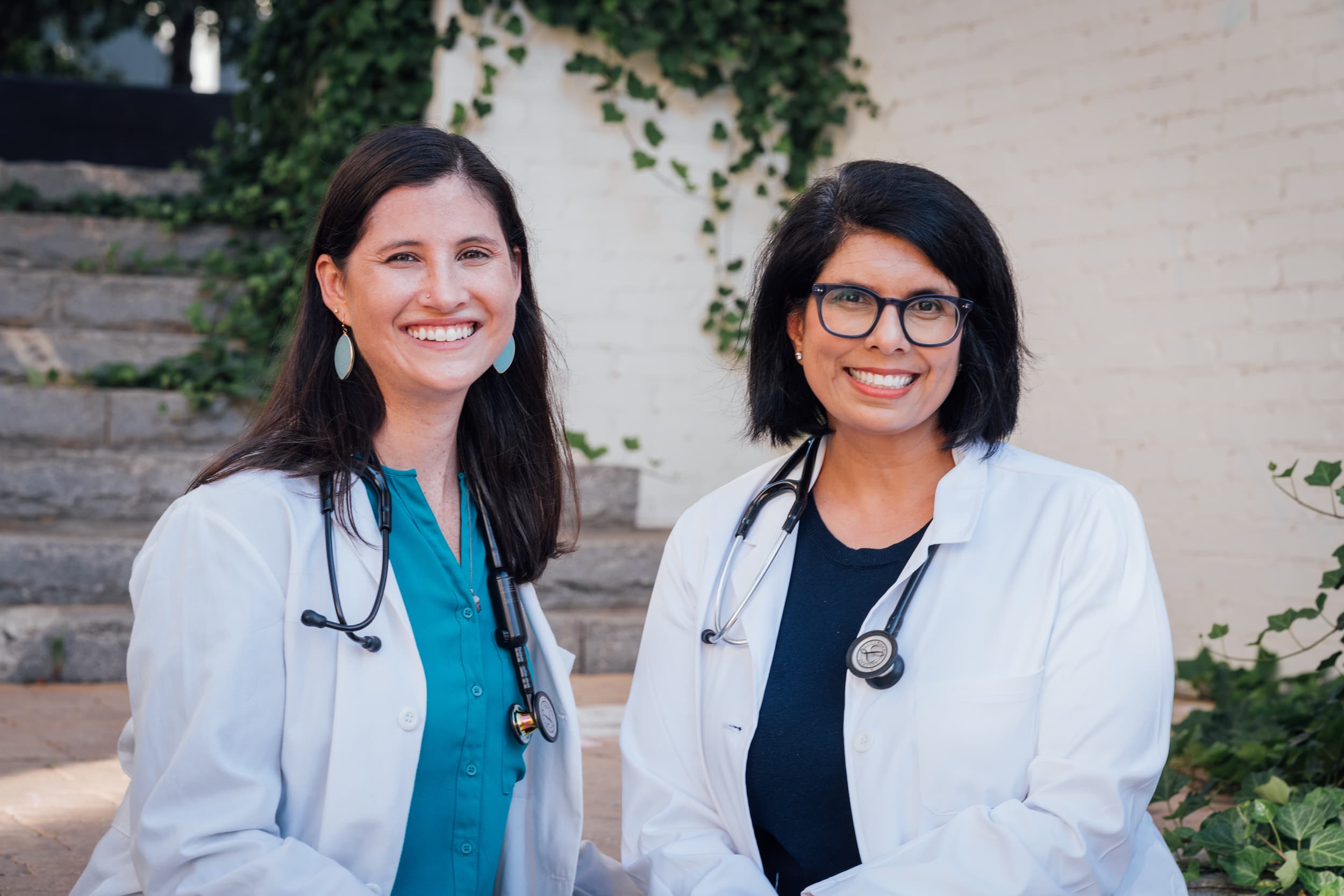 Doctors Blackmon and Escalante outside of the office in Serenbe